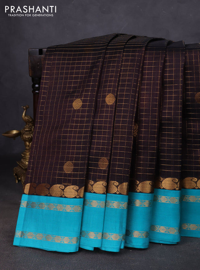 Kuppadam silk cotton saree black and teal blue with allover zari checks & buttas and paisley zari woven border