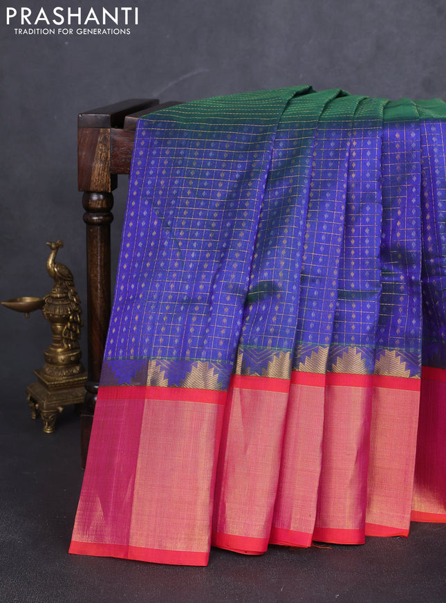 Kuppadam silk cotton saree navy blue and orange with allover zari checks & lakshadeepam weaves and temple design long zari border