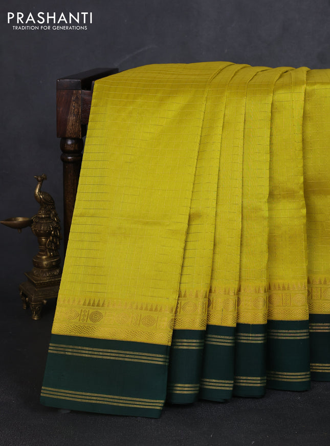 Kuppadam silk cotton saree yellow and bottle green with allover zari checked pattern and zari woven border