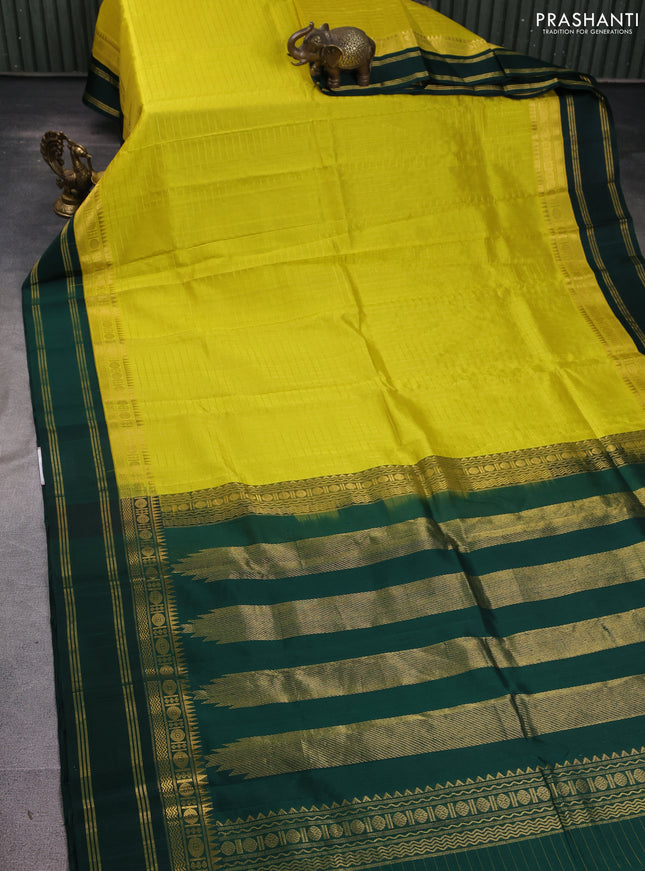 Kuppadam silk cotton saree yellow and bottle green with allover zari checked pattern and zari woven border