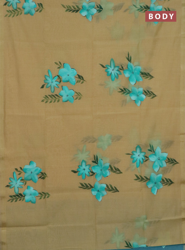 Linen cotton saree sandal and teal green with floral hand paint prints and zari woven border