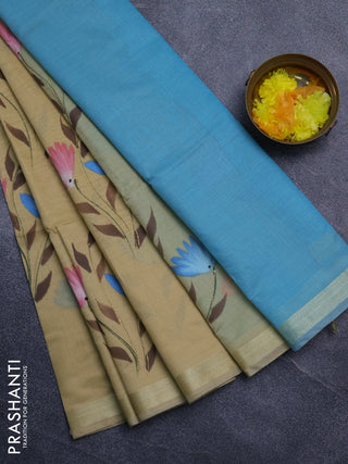 Linen cotton saree sandal and teal blue with floral hand paint prints and zari woven border