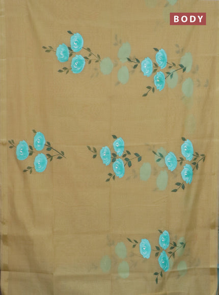 Linen cotton saree sandal and teal blue with floral hand paint prints and zari woven border