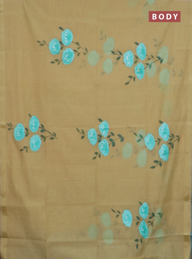 Linen cotton saree sandal and teal blue with floral hand paint prints and zari woven border