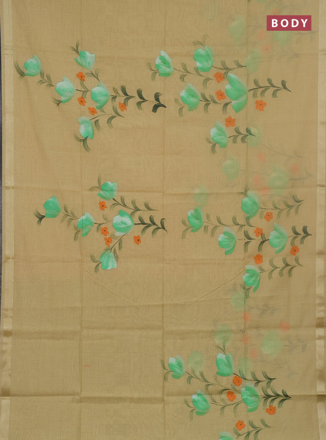 Linen cotton saree sandal and light green with floral hand paint prints and zari woven border