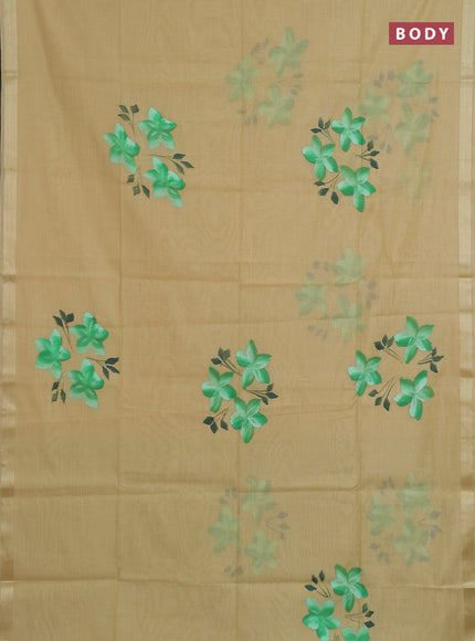 Linen cotton saree sandal and light green with floral hand paint prints and zari woven border