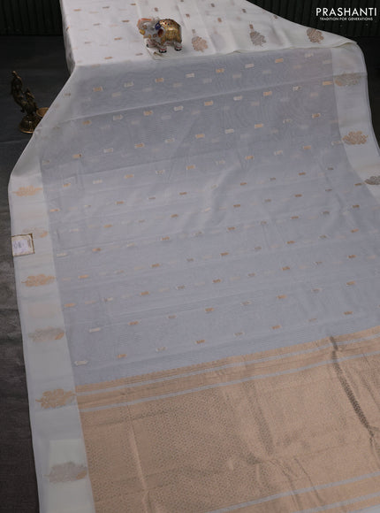 Art kota saree cream with zari woven buttas and zari woven floral butta border