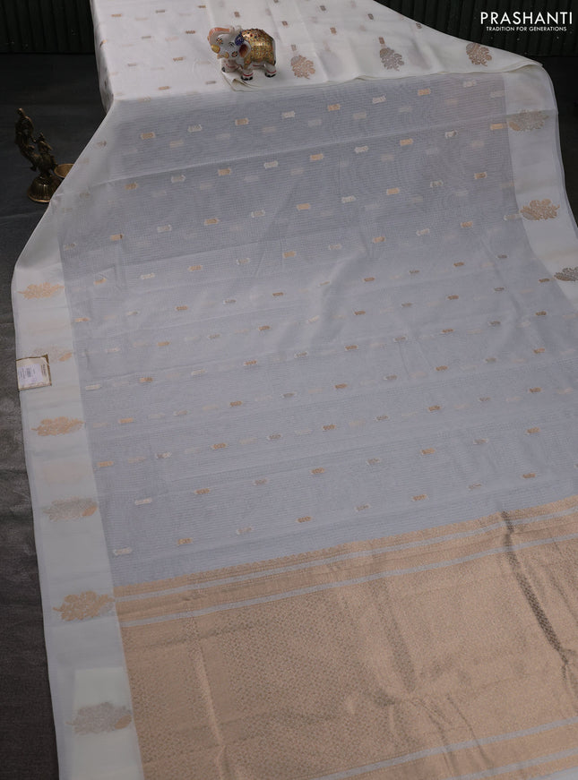 Art kota saree cream with zari woven buttas and zari woven floral butta border