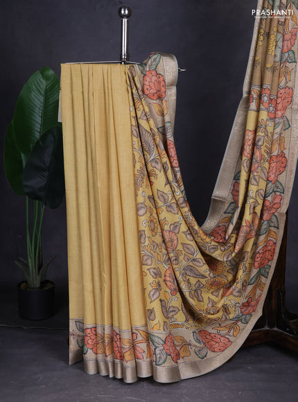 Linen tussar partly saree sandal and beige pastel green with kalamkari prints and zari woven border
