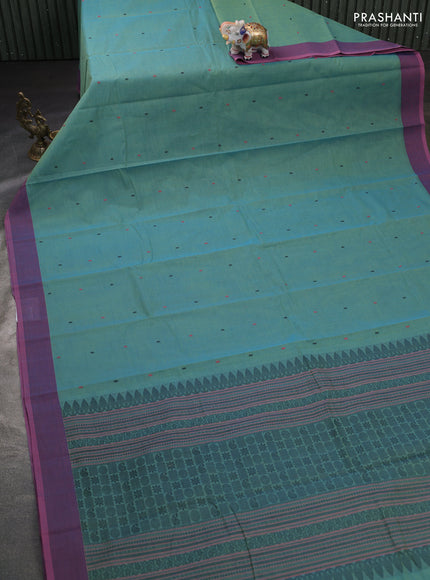 Kanchi cotton saree dual shade of bluish yellow and pastel pink with thread woven buttas and thread woven border