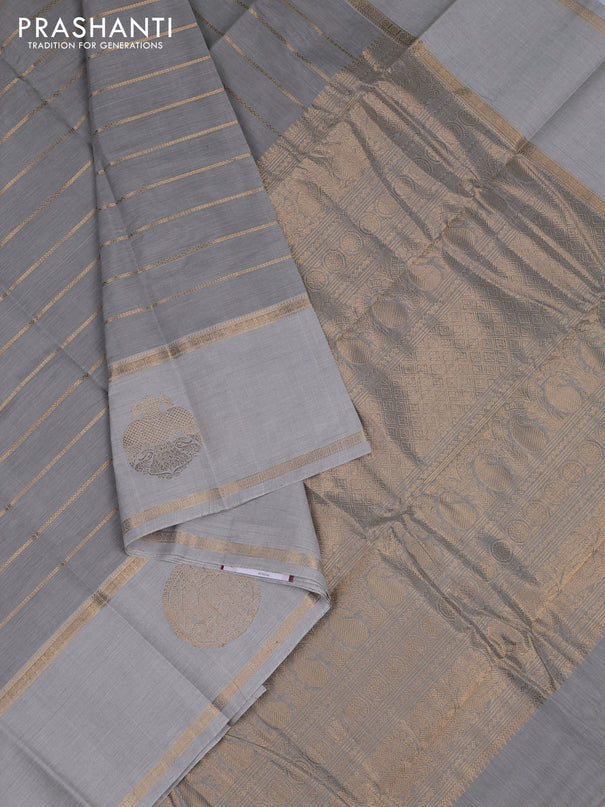 Kanchi cotton saree pastel grey with allover zari weaves and rettapet zari woven border