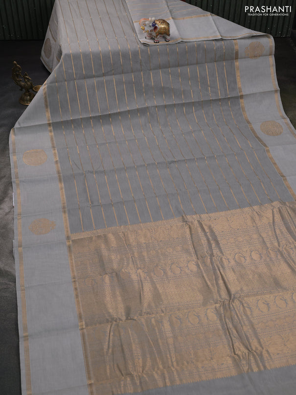 Kanchi cotton saree pastel grey with allover zari weaves and rettapet zari woven border