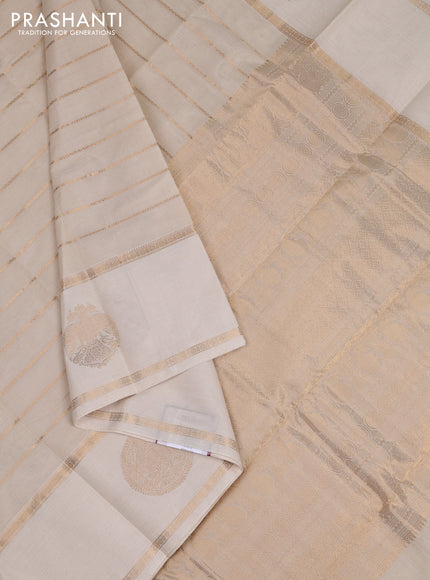 Kanchi cotton saree cream with allover veldhari pattern and long rettapet zari woven border