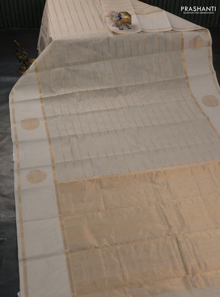 Kanchi cotton saree cream with allover veldhari pattern and long rettapet zari woven border