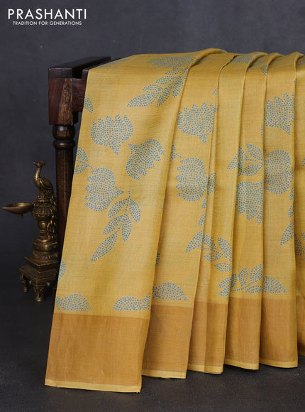 Pure tussar silk saree yellow shade with allover prints and zari woven border