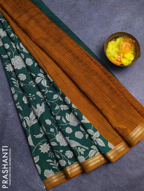 Muslin silk saree green and dark mustard with allover floral prints and zari woven border