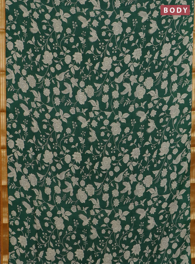 Muslin silk saree green and dark mustard with allover floral prints and zari woven border