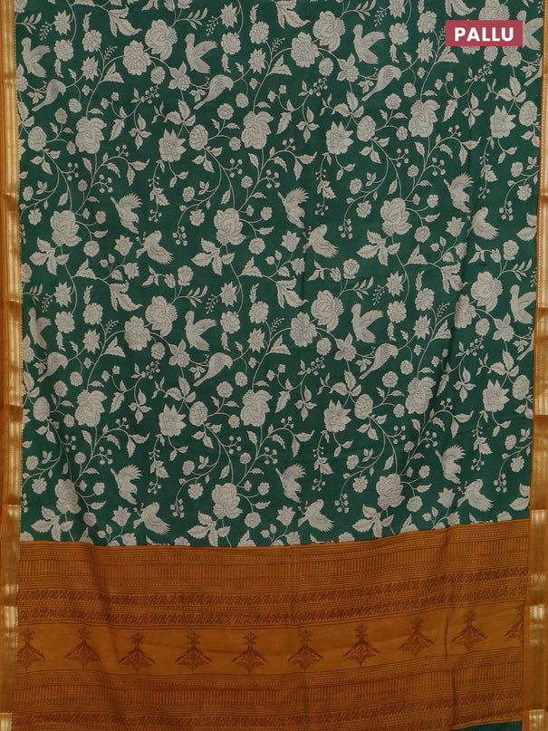 Muslin silk saree green and dark mustard with allover floral prints and zari woven border