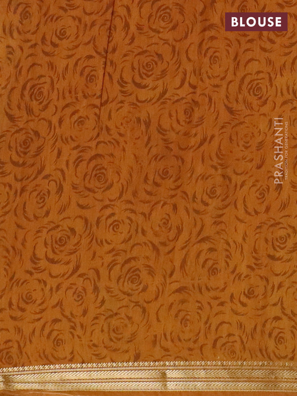 Muslin silk saree green and dark mustard with allover floral prints and zari woven border