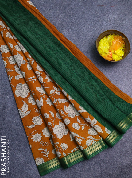 Muslin silk saree dark mustard and green with allover floral prints and zari woven border