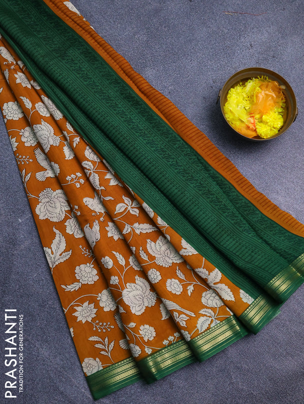 Muslin silk saree dark mustard and green with allover floral prints and zari woven border