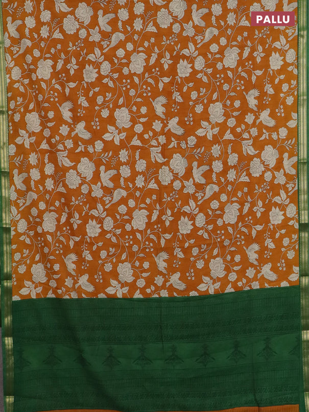 Muslin silk saree dark mustard and green with allover floral prints and zari woven border