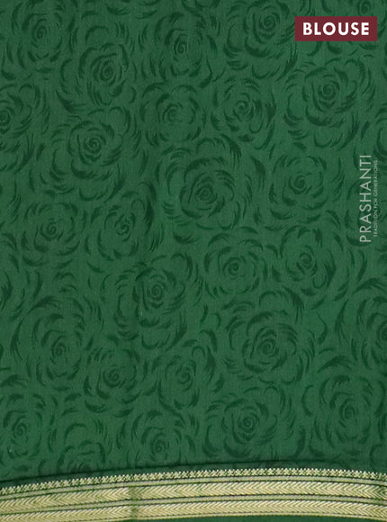 Muslin silk saree dark mustard and green with allover floral prints and zari woven border