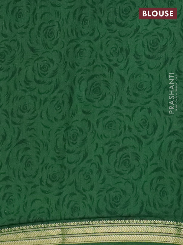 Muslin silk saree dark mustard and green with allover floral prints and zari woven border