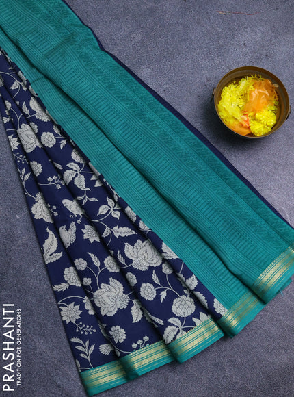 Muslin silk saree navy blue and teal green with allover floral prints and zari woven border