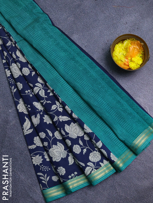 Muslin silk saree navy blue and teal green with allover floral prints and zari woven border