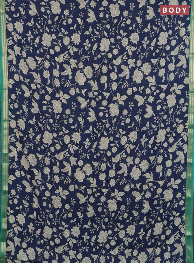 Muslin silk saree navy blue and teal green with allover floral prints and zari woven border