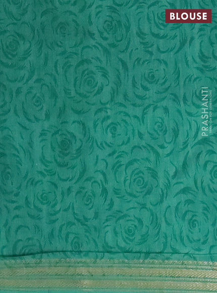 Muslin silk saree navy blue and teal green with allover floral prints and zari woven border