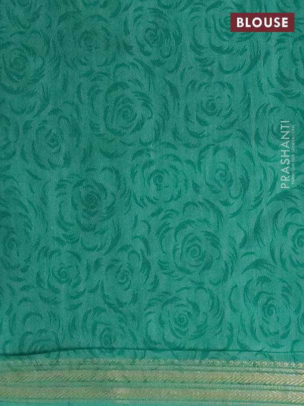 Muslin silk saree navy blue and teal green with allover floral prints and zari woven border