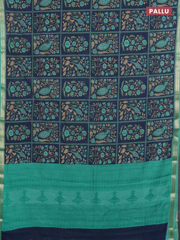Muslin silk saree navy blue and teal green with allover prints and zari woven border