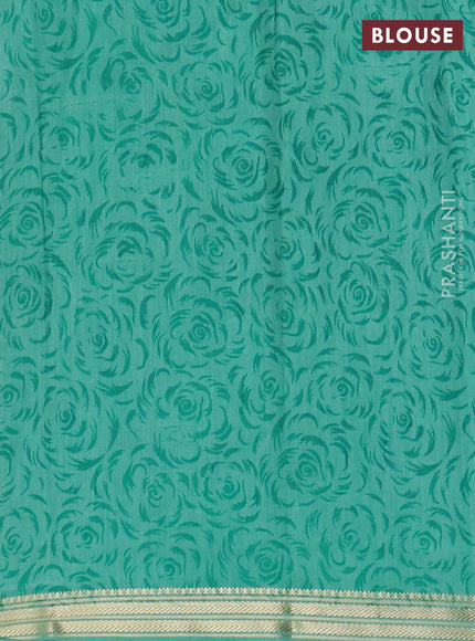 Muslin silk saree navy blue and teal green with allover prints and zari woven border