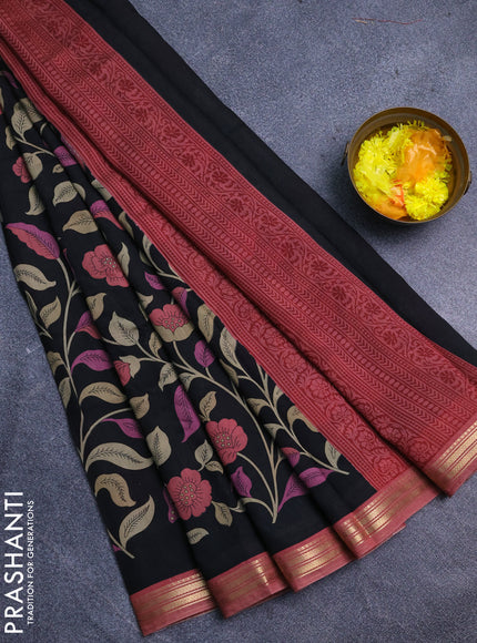 Muslin silk saree black and peach shade with allover prints and zari woven border