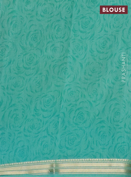 Muslin silk saree navy blue and teal green with allover prints and zari woven border