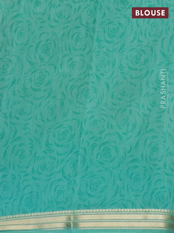 Muslin silk saree navy blue and teal green with allover prints and zari woven border