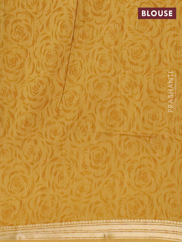 Muslin silk saree green and mustard yellow with allover prints and zari woven border