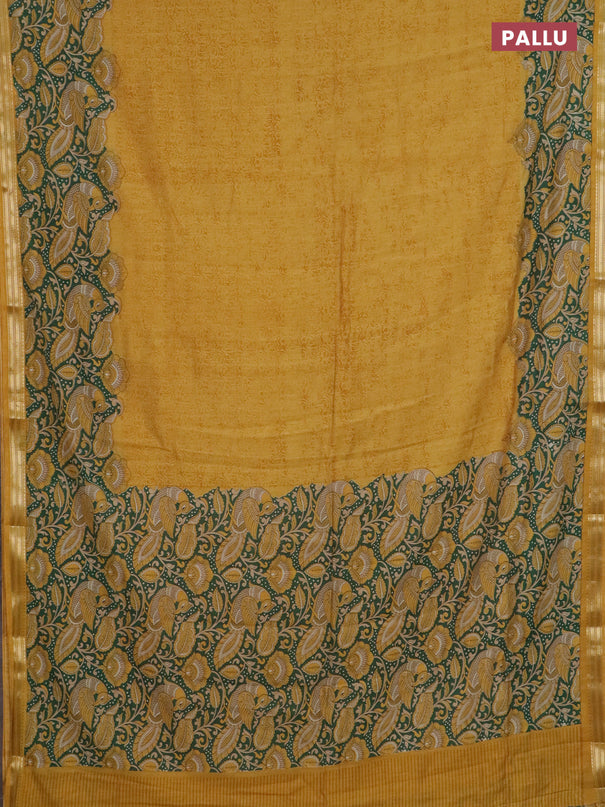 Muslin silk saree mustard yellow and green with prints and long kalamkari printed zari border