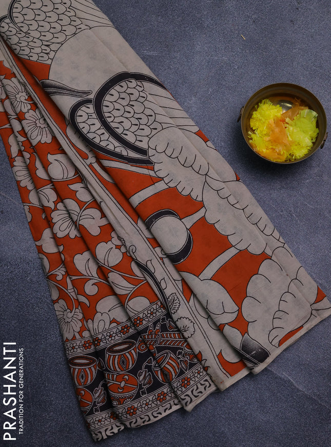 Kalamkari cotton saree orange and black with allover prints and printed border