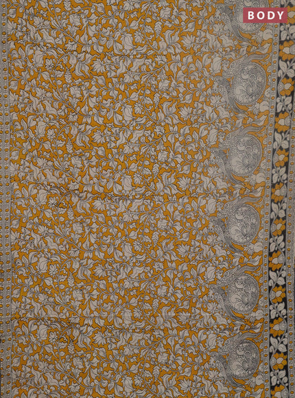 Kalamkari cotton saree yellow and black with allover prints and printed border