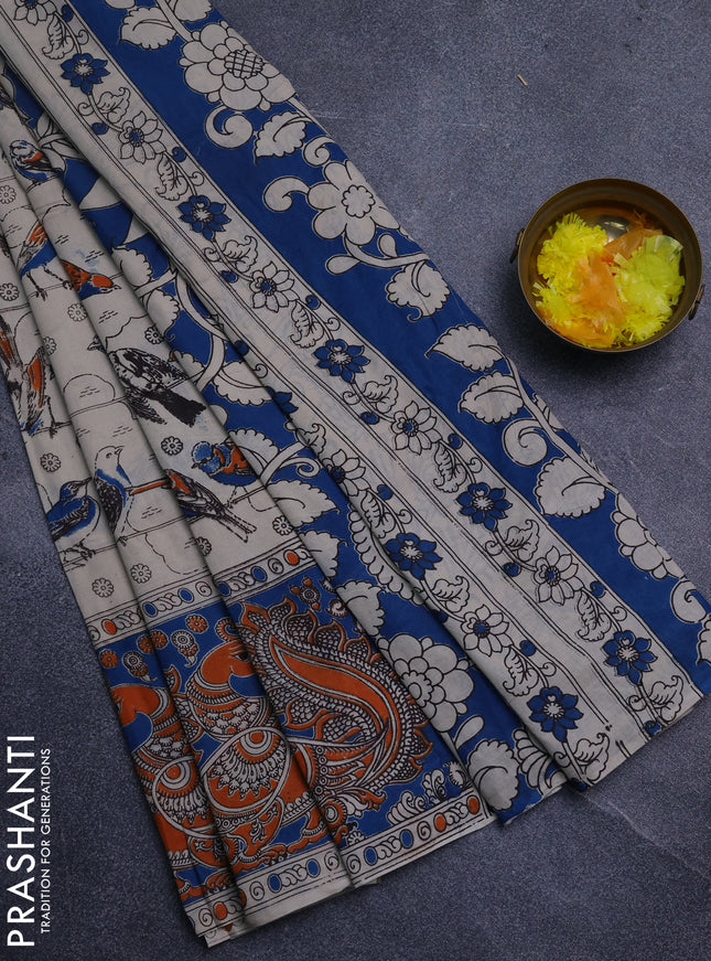 Kalamkari cotton saree beige and orange with allover prints and long printed border
