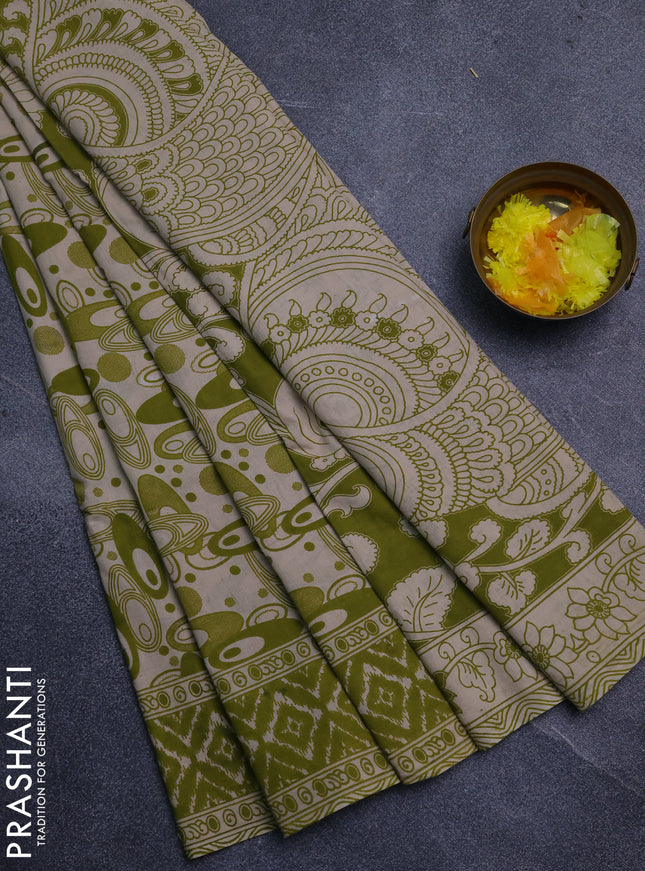Kalamkari cotton saree light green and beige with allover geomatric prints and printed border