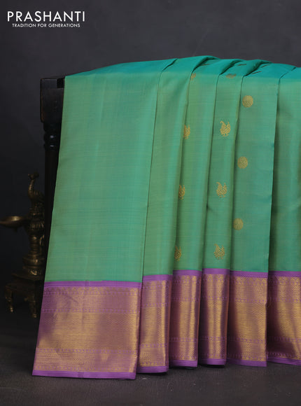Pure kanchipuram silk saree teal green shade and lavender with annam & rudhraksha zari woven buttas and zari woven border