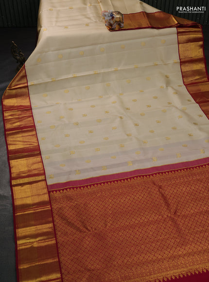 Pure kanchipuram silk saree cream and dark pink with zari woven buttas and rich zari woven border
