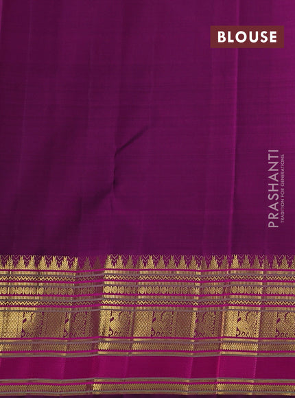 Pure kanchipuram silk saree teal shade and purple with plain body and long zari woven korvai border
