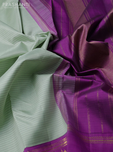 Pure kanchipuram silk saree pastel green and purple with allover stripe pattern and rich zari woven butta border