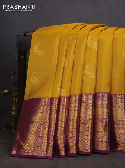 Pure kanchipuram silk saree mustard yellow and purple with paisley zari woven buttas and long zari woven border