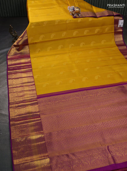 Pure kanchipuram silk saree mustard yellow and purple with paisley zari woven buttas and long zari woven border